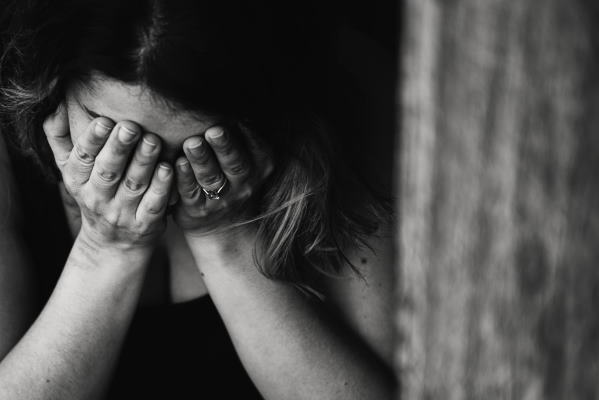 woman covering her eyes